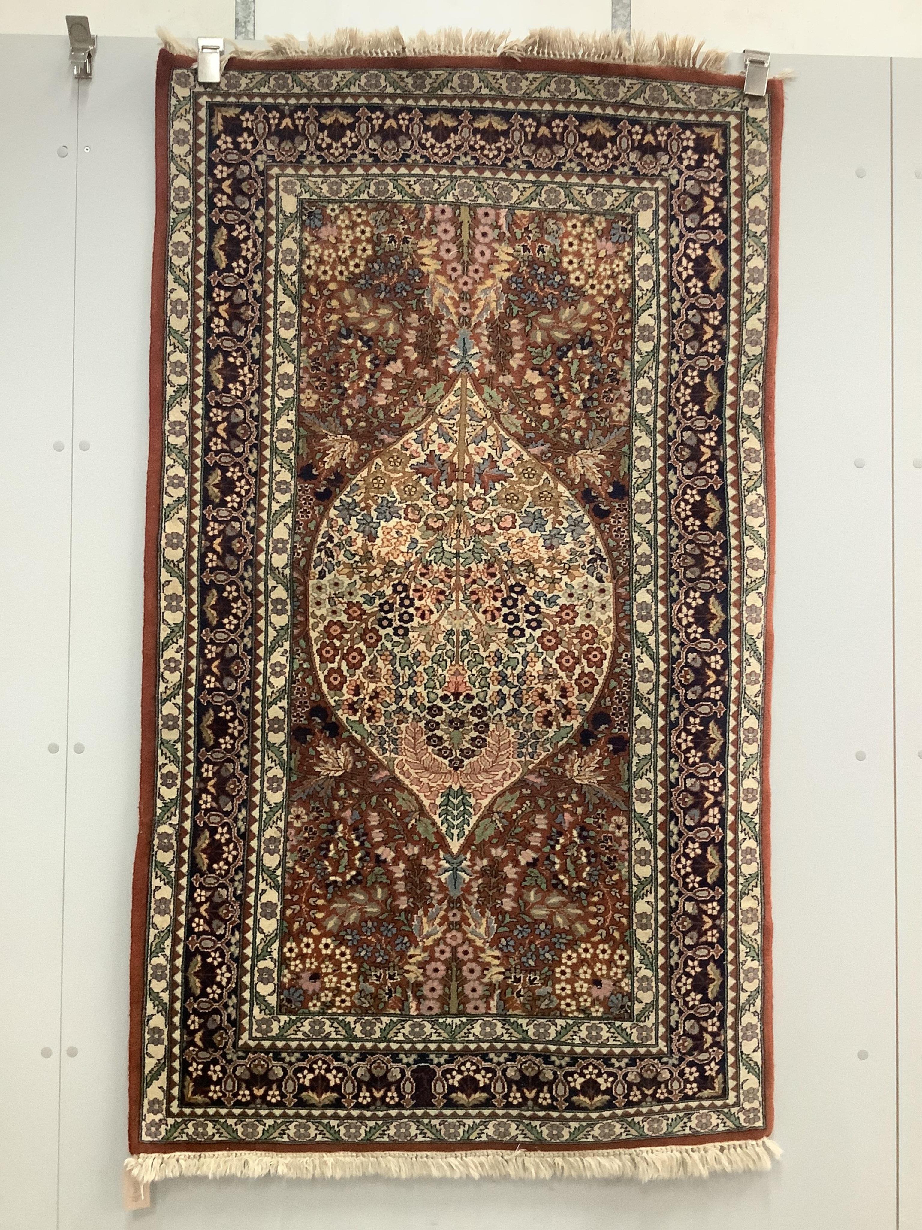 A Persian russet ground rug, 160 x 93cm. Condition - light wear to fringes, otherwise good